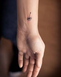 Amazing birds blowing from dandelion tattoo. Top 10 Best Dandelion Tattoos And Meanings Styles At Life