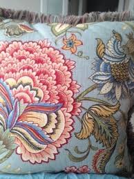 A field of colorful poppies grow tall and fade out into soft pastels in the background. Please Help Me Choose An Arm Chair And Paint Color