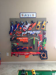 Have a bunch of nerf guns laying around and want to get them out of the way and also add an awesome nerf gun rack to your room? Pin On Ideas For The House