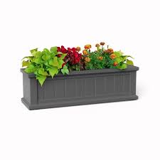 Hanging planter boxes under windows. The Promenade Vinyl Window Box