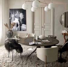 Gorgeous dining room decorated with a round carved wood wall art mounted above the white wainscoting. Tone On Tone Beige With Shag Rug In Dining Room Dining Room Rug Living Room Decor Modern Living Room Leather