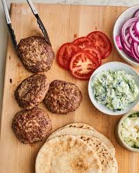 Greek Style Lamb Burgers With Creamy Tzatziki Sauce Recipe Lamb Burgers Lamb Recipes Lamb Burger Recipes