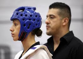 Diana Lopez, left, gets ready to square off against Danielle Holmquist as her older brother and coach Jean Lopez ... - Diana%2BLopez%2B2012%2BOlympic%2BTeam%2BTrials%2BTaekwondo%2BmNgKs8aRGGrl