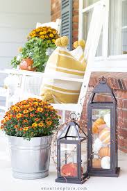 Besides turning leaves nothing announces the change of seasons more than your homes front door. Porch Fall Decorating Ideas Mums Pumpkins On Sutton Place