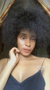 Naomi stitches student work in Abakaliki