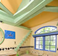 The fully functional (running water) marble bathroom is a short walk down a rustic path through the bamboo forest. The Man Who Turned His House Into A Feline Fantasy Builder Creates Utopia For His 14 Cats Complete With Ledges Tunnels And Soothing Music Daily Mail Online
