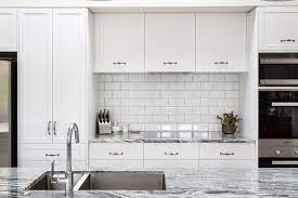 Try using large red tiles for your white kitchen to provide a minimalist and clean look. Kitchen White Tile Splashback Novocom Top