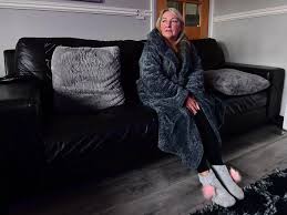 Mum forced to wear layers to keep warm in freezing cold house