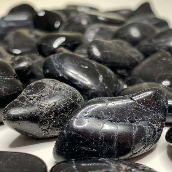 Black Tourmaline provides an impenetrable energetic boundary when used in protection grids., AI generated