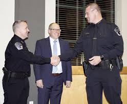 New chief gets badge pinned at council meeting