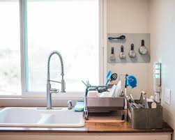 Corner kitchen sink ideas are the best combo for small kitchen, this is the list for you with cabinet or base, layout, undermount, and more design. Kitchen Sink Organizer Ideas For A Bright Minimalist Home