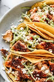 Brush the salmon with 1 tablespoon of the lime juice and sprinkle with the chipotle seasoning mixture. Salmon Tacos With Slaw Easy Healthy Recipe Wellplated Com
