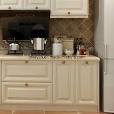 To start, remove the drawers and doors and label each piece that you remove to make reinstallation a i was looking particularly on painting particle board kitchen cabinets and this article had a few specific tips. China American Style Melamine Particle Board Kitchen Cabinet China Kitchen Cabinet Melamine Kitchen Cabinet