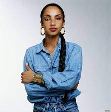 Photos Braided Hairstyles We Ll Always Love From Liz Taylor To Janet Jackson Sade Tomboy Fashion Sade Adu
