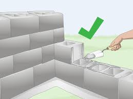 The top of the cinder portion of the wall has concrete tops (landscape blocks), and even a little bit of a gap causes the blocks on top to be unsteady. How To Build A Cinder Block Wall With Pictures Wikihow
