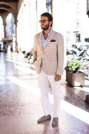 A Chic Look With A Light Blue Shirt A Tan Blazer White Pants Tan Leather Moccasins And Su Wedding Guest Outfit Summer Beach Wedding Attire Wedding Suits Men