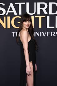 Dakota Johnson Puts Her Own Twist on the Safety Pin Dress With a Sexy Slit  | Vogue