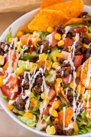 I use catalina dressing only, and i add doritos to instead of plain chips (nacho flavor is the best but you can use any flavor) i also omit the sour cream and add black. Easy Taco Salad Dinner Then Dessert