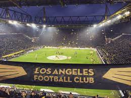 Fitting considering both sets of fans sing 'you'll never walk alone' before matches. He Loved Dortmund S Famed Yellow Wall The 25 000 Capacity Supporters Stand That Is The Heart Of One Of The Los Angeles Football Club Soccer World Dortmund
