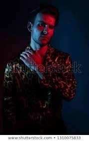 Art Neon Glamor Fashion Men S Model Tests Handsome Guy Model Posing In Leopard Shirt On A Blue And Red Fil Neon Portrait Fashion Model Photography Photos Neon