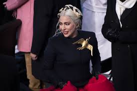 The title card the hunger games: The Meaning Behind Lady Gaga S Schiaparelli Gold Brooch From Her Inauguration Outfit Tatler Hong Kong