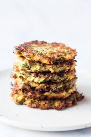 Place the grated zucchini in a clean cloth and wring out the excess moisture. Vegan Courgette Fritters Lazy Cat Kitchen