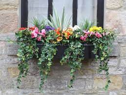 Totally understandable if you just did a double take. Pin By Teresa Orrico On Flowers Window Box Flowers Window Planters Artificial Flowers