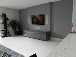 A Recessed 65 Tv In Wall B W 3 Way Speakers And The Equipment Seamlessly Hidden Inside The Cabinet Below In Wall Speakers Living Room Speakers Room Speakers