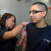 unner's Mate 2nd Class Leticia Chupany, from Salinas, Puerto Rico, and  Gunner's Mate 3rd Class Eric Acuna, from Aransas Pass, Texas, shoot lines  from the aircraft carrier USS Ronald Reagan (CVN 76). -