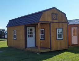 What are the shipping options for sheds? 12x24 Lofted Barn Cabin With 4 X8 Porch On Left Side Burgundy Metal Roof With Matching Trim Honeygold Stained Doug Lofted Barn Cabin Cabin Loft Barn Cabin
