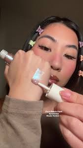 @r.e.m. beauty liquid eyeshadow in the shade: FEMBOT 🌌✨ such a gorggg  mesmerizing glitter shade 🤩 #arianagrande #rembeauty  #rembeautybyarianagrande #rembeautyliquideyeshadow #liquideyeshadow