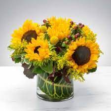 It was a record breaker and the neighbor boy pulled me around on his sled! Augusta And Martinez Ga Flower Delivery Flowers On Broad Sunflower Arrangements Flower Delivery Sunflower Centerpieces