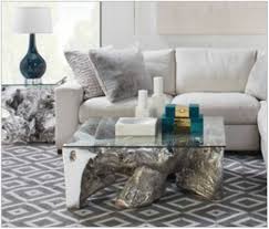 Ado chale rare coffee table with arizona petrified sequoia wood inlaid in thick lacquered resin tabletop resting on 3 sets of black painted tripod steel brackets. Z Gallerie Coffee Tables Tampacrit Com