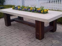 Granite is also great for rolling out large batches of cookie dough or for kneading bread dough. Barn Timber Stone Top Dining Table Mecox Gardens