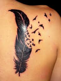 Feather With Birds Flying Away Tattoo Birds Flying Off From A Feather Back Shoulder Tattoo Unique Tattoos For Women Tattoos For Women Trendy Tattoos