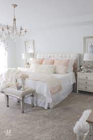 A neutral feminine bedroom with a white upholstered bed, white nightstands, a blush couch and a purple pillow and blush curtains. Master Schlafzimmer Updates Fur Den Herbst Winter 1000 Feminine Bedroom Cozy Master Bedroom Master Bedroom Update