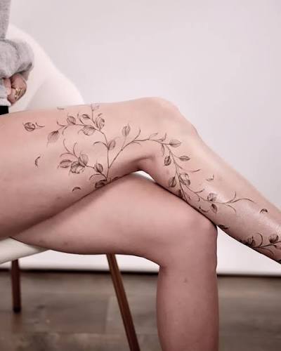 A freehand fine line vine leg sleeve that flows with the body—rather than covering it. ⁠ Freehanded to honor natural form and movement, this soft vine design weaves around texture and shape
