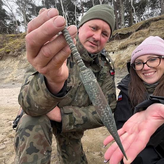 Metal Detectorists Unearth Ancient Dagger Decorated With Tiny Stars,  Crescent Moons and Geometric Patterns