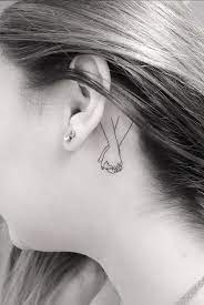 38 Pretty Behind The Ear Tattoos That Will Please You Page 36 Of 38 Lily Fashion Style Hand Holding Tattoo Tattoo Behind The Ear Behind Ear Tattoos