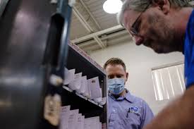 Postal clerks and carriers are busy as ever at Saginaw's Boardwalk branch