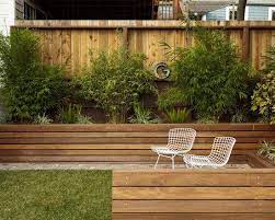 Beautiful Landscape Exterior With Wooden Retaining Walls And Patio Furniture Backyard Retaining Walls Modern Landscaping Backyard