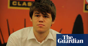 Magnus carlsen lifts the trophy as russian president vladimir putin, viswanathan anand and fide president kirsan ilyumzhinov look on | photo: Magnus Carlsen Magnus Carlsen The Guardian
