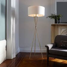 Its height is adjustable, so you can direct light wherever you need it. Mid Century Tripod Floor Lamp