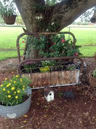 An Old Bed Frame And Some Ceiling Tins Make A Nice Flower Bed Old Bed Frames Flower Beds Garden Flower Beds