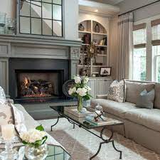 Balancing furniture on either side of the fireplace helps make the best use of this space. Taupe Grey Living Room Ideas Photos Houzz