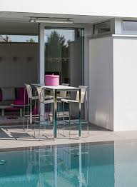 For a lighter look that is ideal in a modern setting, glass black pub tables are a neutral choice with masculine flair that is a great fit for a contemporary man cave. Nimio Bar 140 190 Cima Collection Fueradentro Outdoor Design Furniture