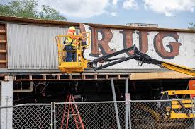 Sign for Stanley Drug Store in Charlotte unveiled during renovations