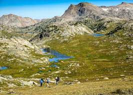 Surrounded by the towering peaks of the wind river, absaroka, and owl creek mountain ranges. Backpack Wind River Range Wyoming Sierra Club Outings