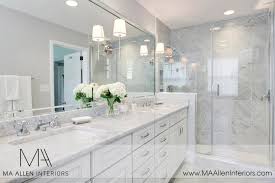 Ma Allen Interiors White And Gray Master Bathroom With Gray Walls Framing White Double Vanity A White Master Bathroom White Marble Bathrooms Bathrooms Remodel
