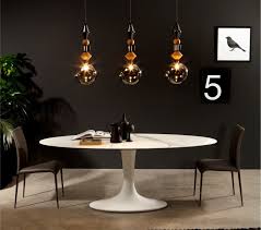 Merge formal and contemporary elements with a table featuring rich walnut and cherry surrounding framing and chocolate leather seats. Tonin Casa Imperial Oval Glass Dining Table Glass Contemporary Dining Room Furniture Ultra Modern